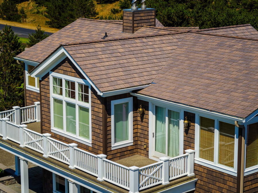 Coastal home with a DaVinci synthetic cedar shake roof in warm, weathered tones