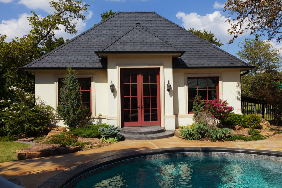 Poolside guest house with a DaVinci synthetic slate roof in a deep charcoal tone
